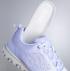 Propét Women’s TravelActiv light purple slip-on medical sneaker with a removable cushioned insole.