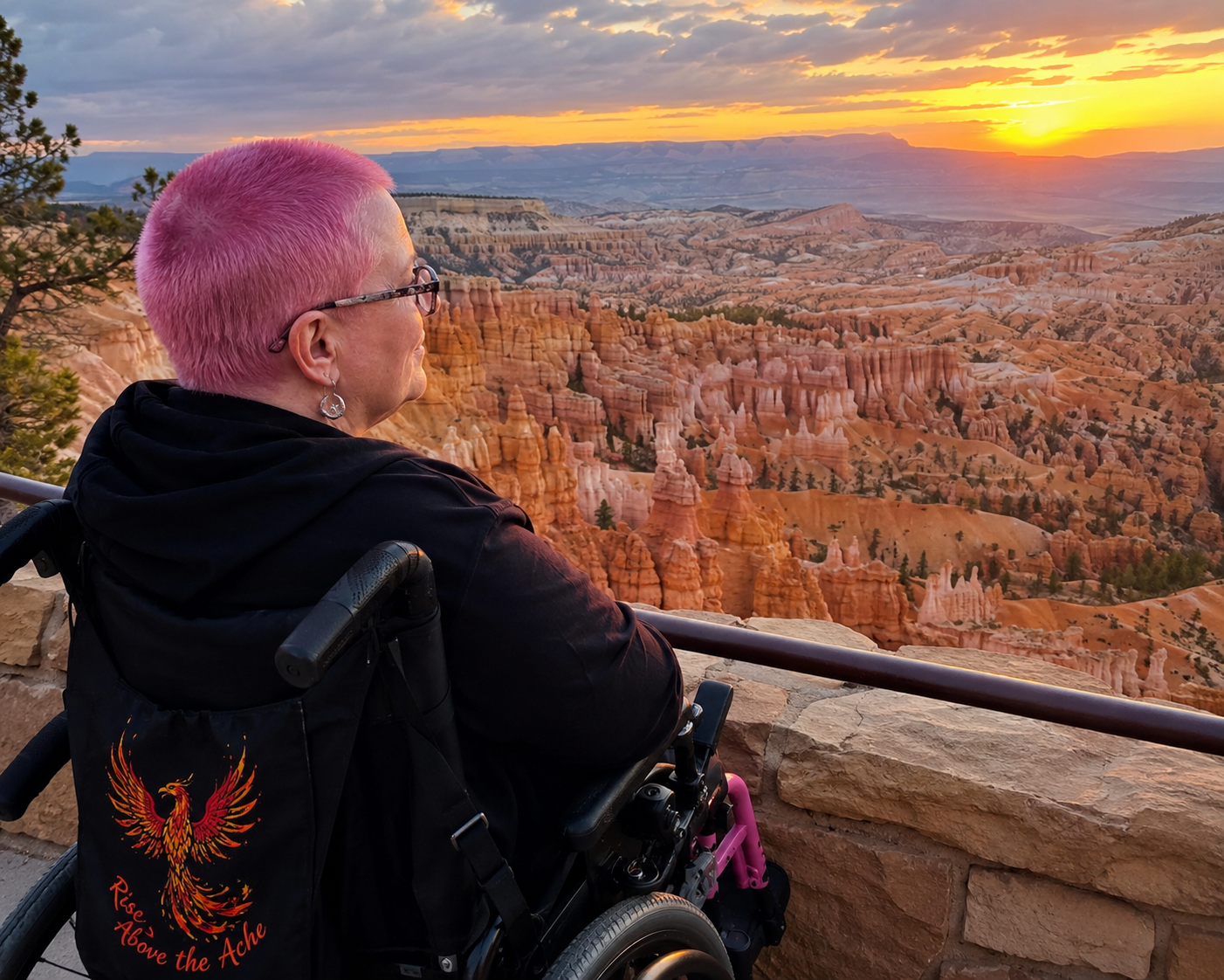 5601 - Rejuva Sole™ Person in a wheelchair with pink hair gazing at Bryce Canyon’s orange hoodoos at sunset from a railing viewpoint