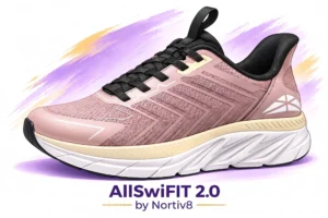 Pink AllswiFIT 2.0 running shoe with black laces, angled side view, white sole, on a pastel purple background; product shot by Nortive8
