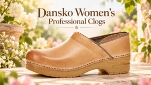 Tan leather Dansko women's professional clog displayed outdoors among white flowers and greenery.